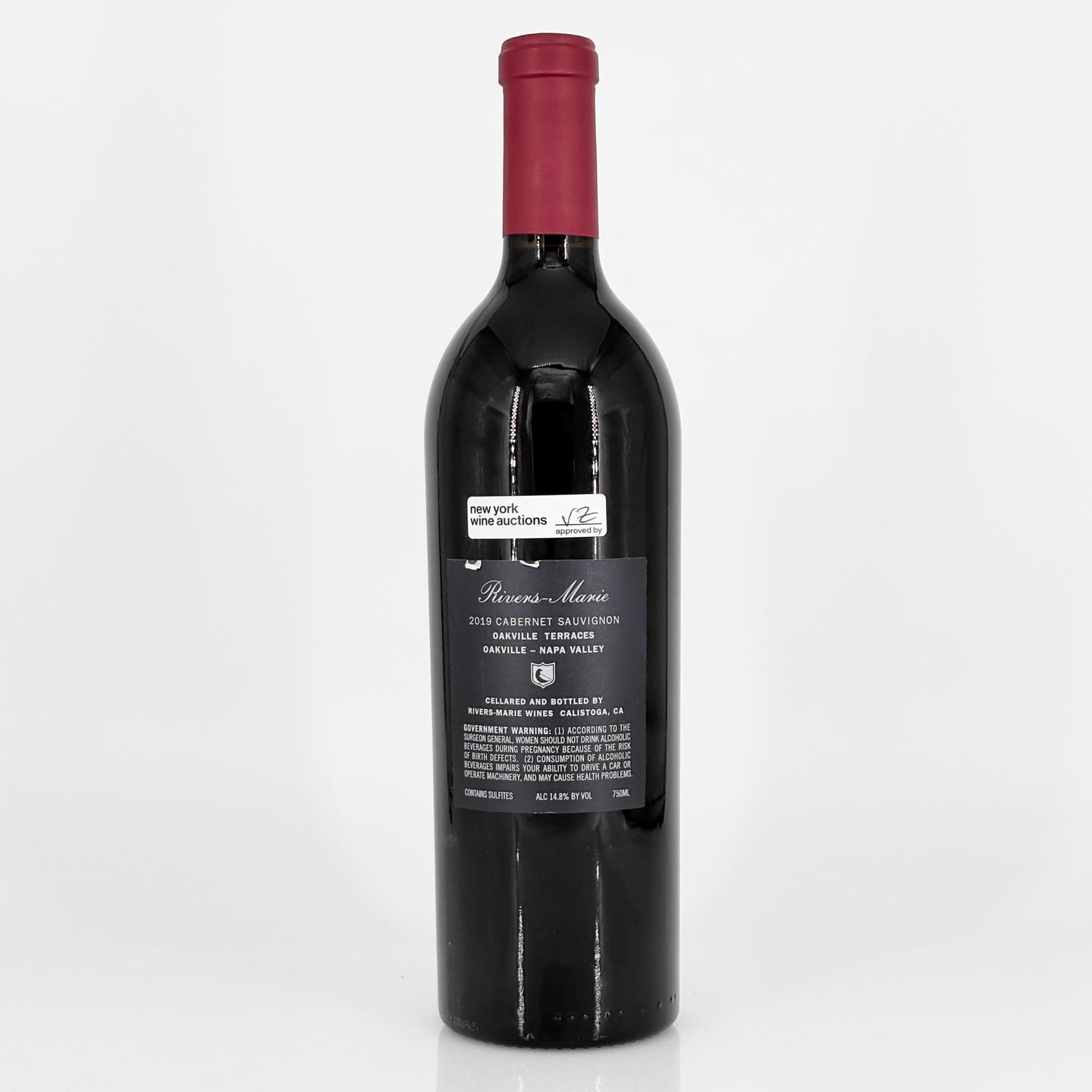Red wine bottle with a visible label on a white background