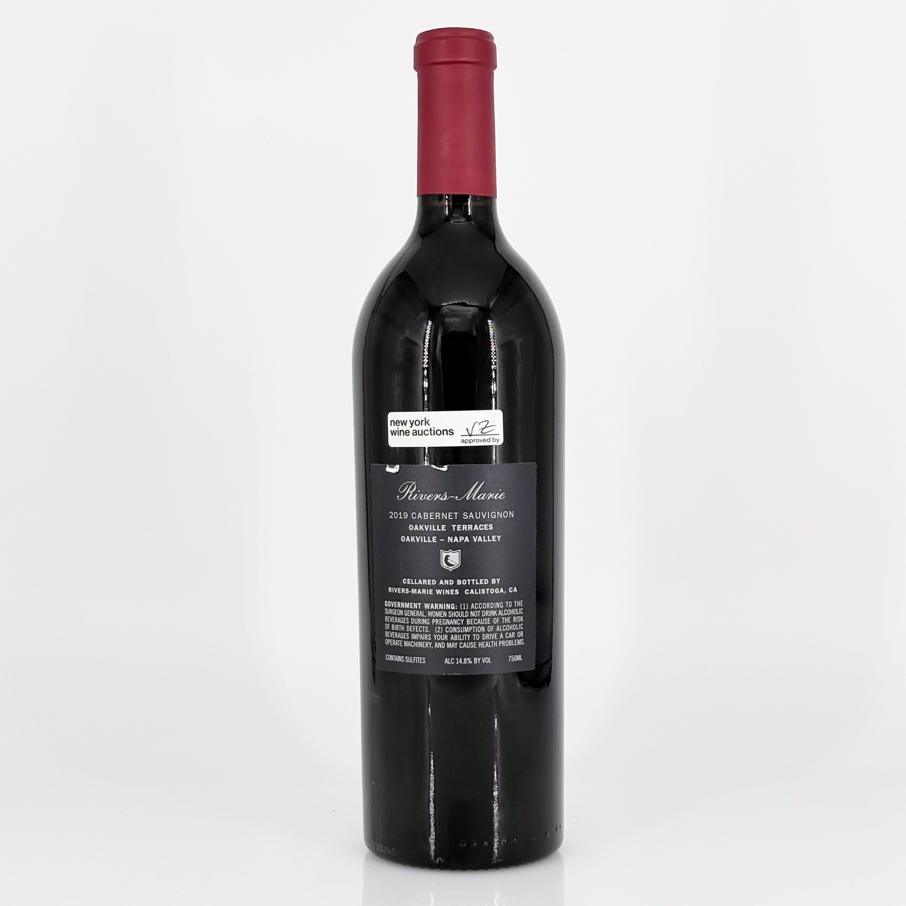 Red wine bottle with a visible label on a white background