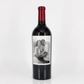 Wine bottle with a label featuring a black and white photo of a couple on a white background