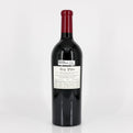 Red wine bottle with a visible label on a white background