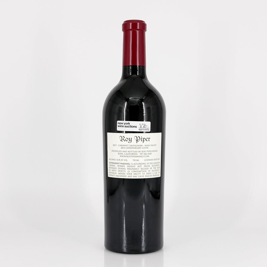 Red wine bottle with a visible label on a white background