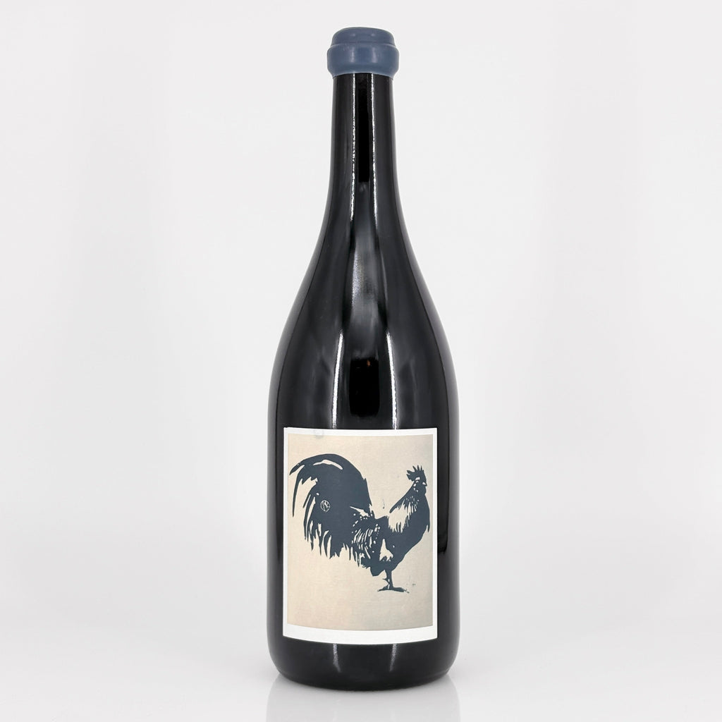 Wine bottle with a rooster label on a white background