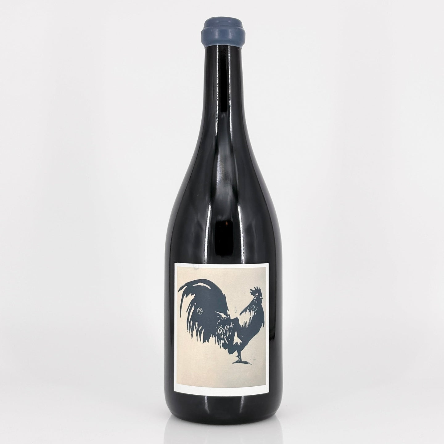 Wine bottle with a rooster label on a white background