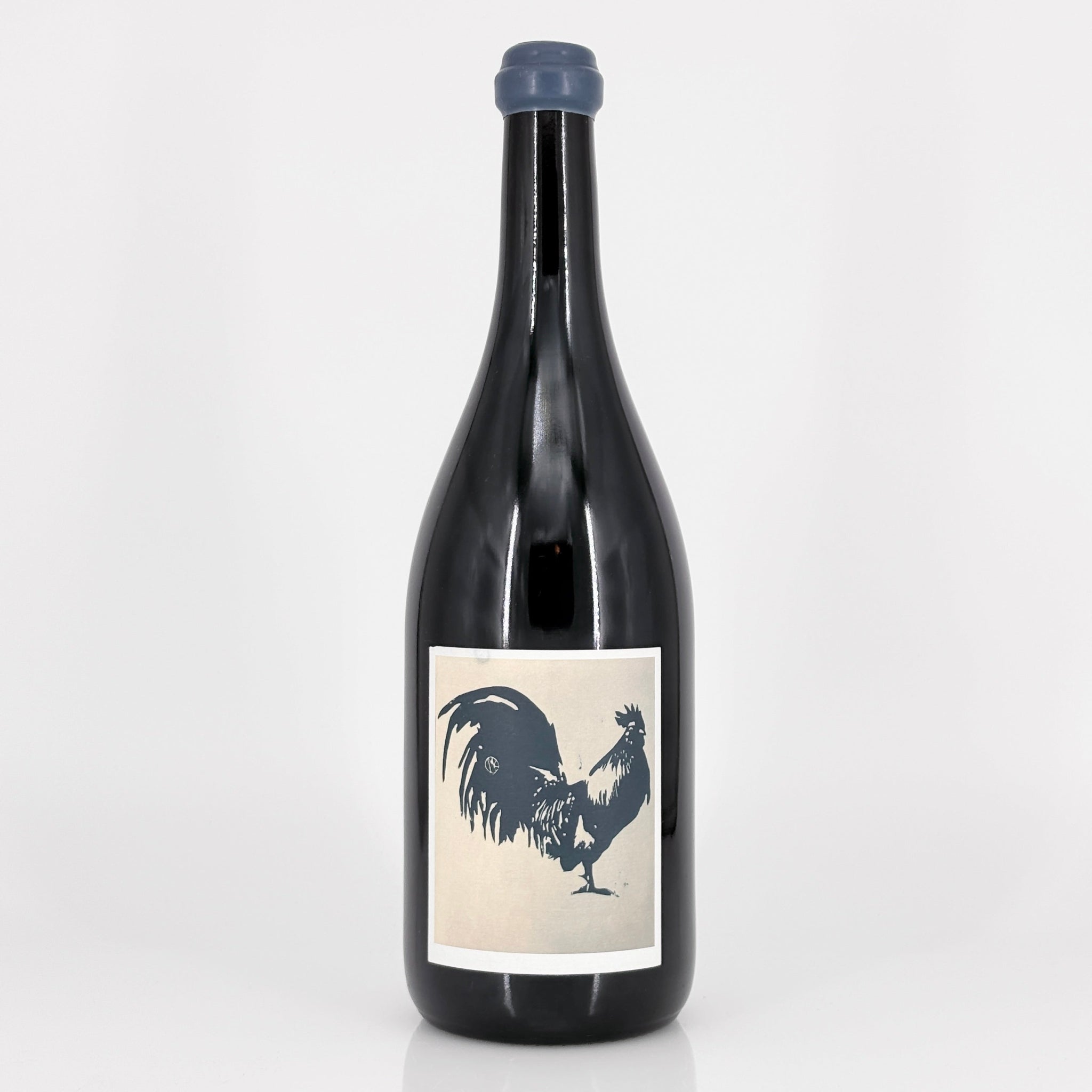 Wine bottle with a rooster label on a white background