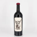 Wine bottle with a label featuring a cow design on a white background