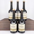Five bottles of  wine in a wooden box on a white background