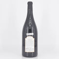 Large wine bottle with a label on a white background