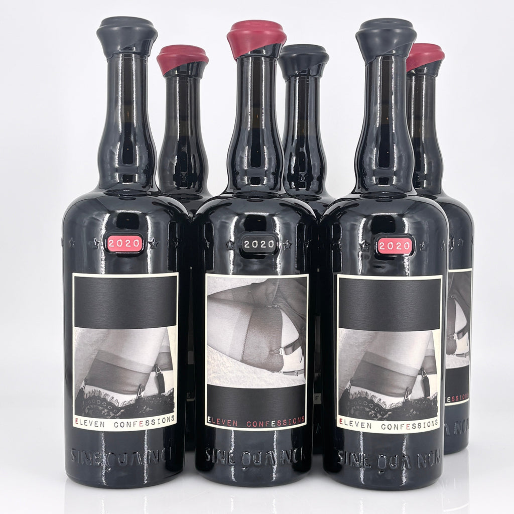 Set of six black bottles with labels on a white background