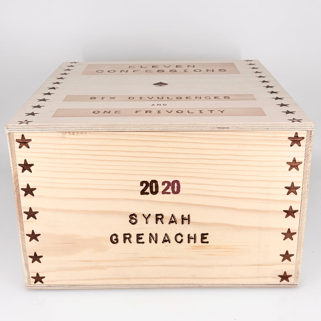 Wooden wine box with engraved text on a white background