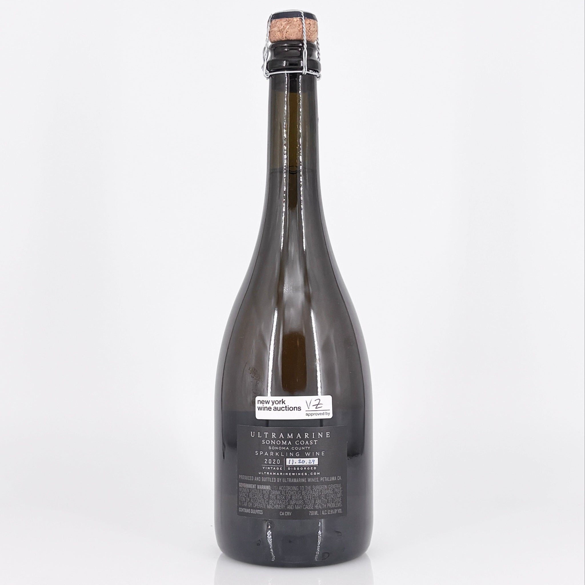 Bottle of Ulteramare with cork on a white background