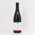 Wine bottle with a white label on a light gray background