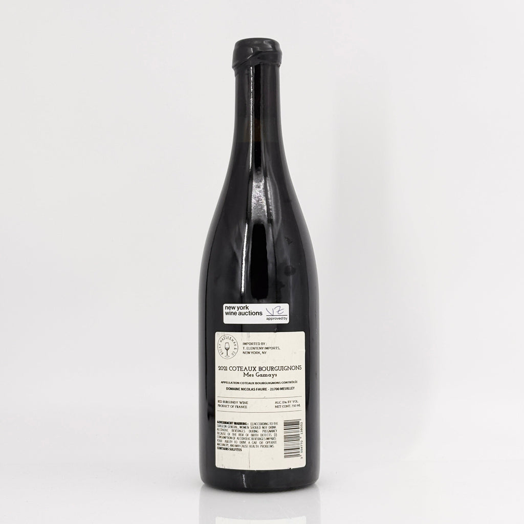 Black wine bottle with a label on a white background