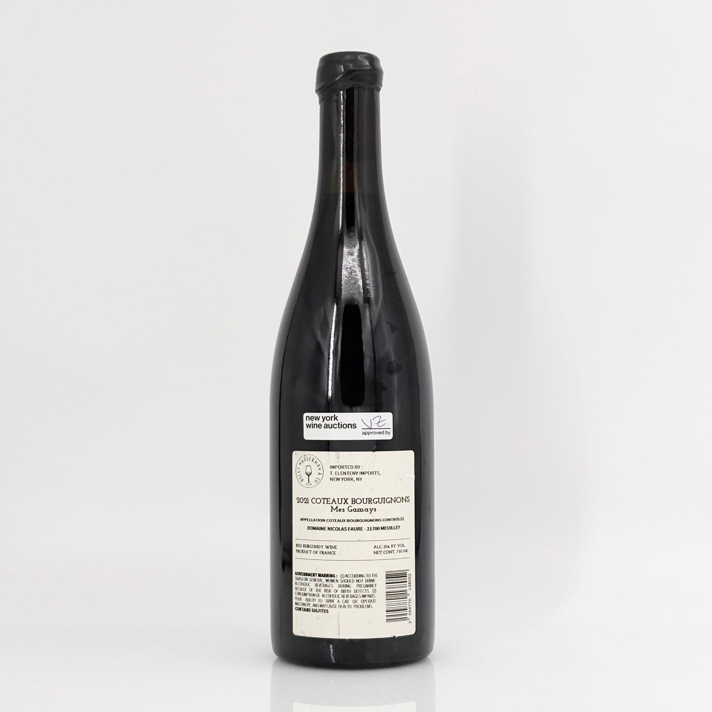 Black wine bottle with a label on a white background
