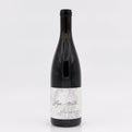 Wine bottle with a marble-patterned label on a white background