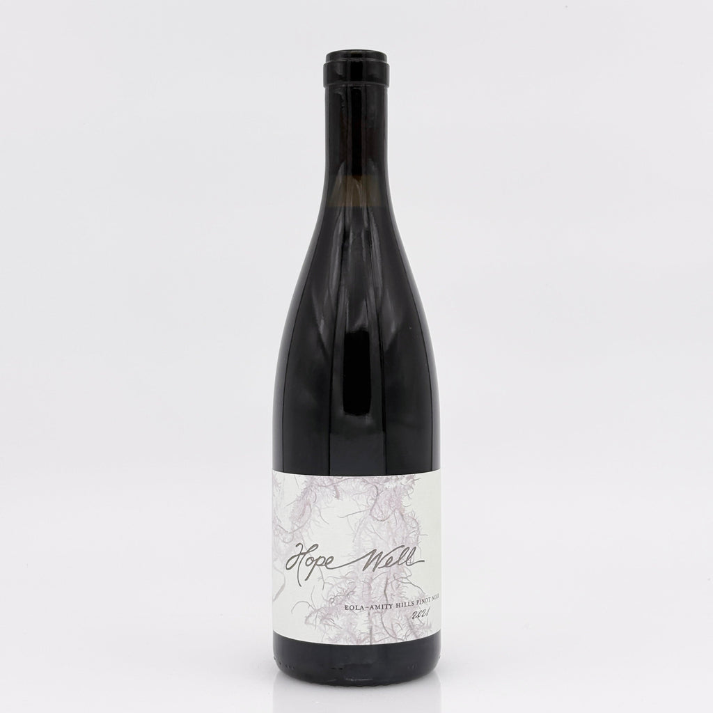 Wine bottle with a marble-patterned label on a white background
