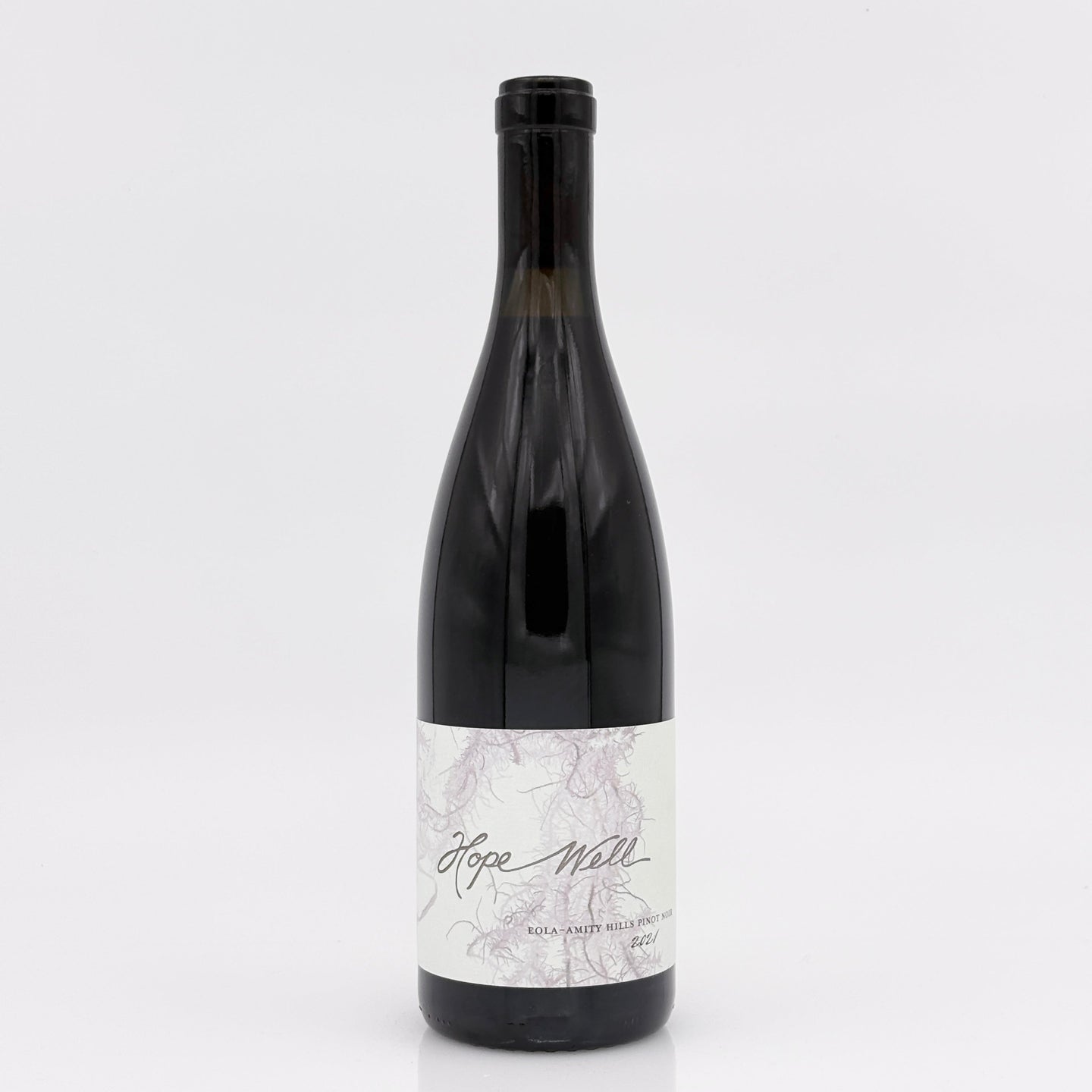 Wine bottle with a marble-patterned label on a white background