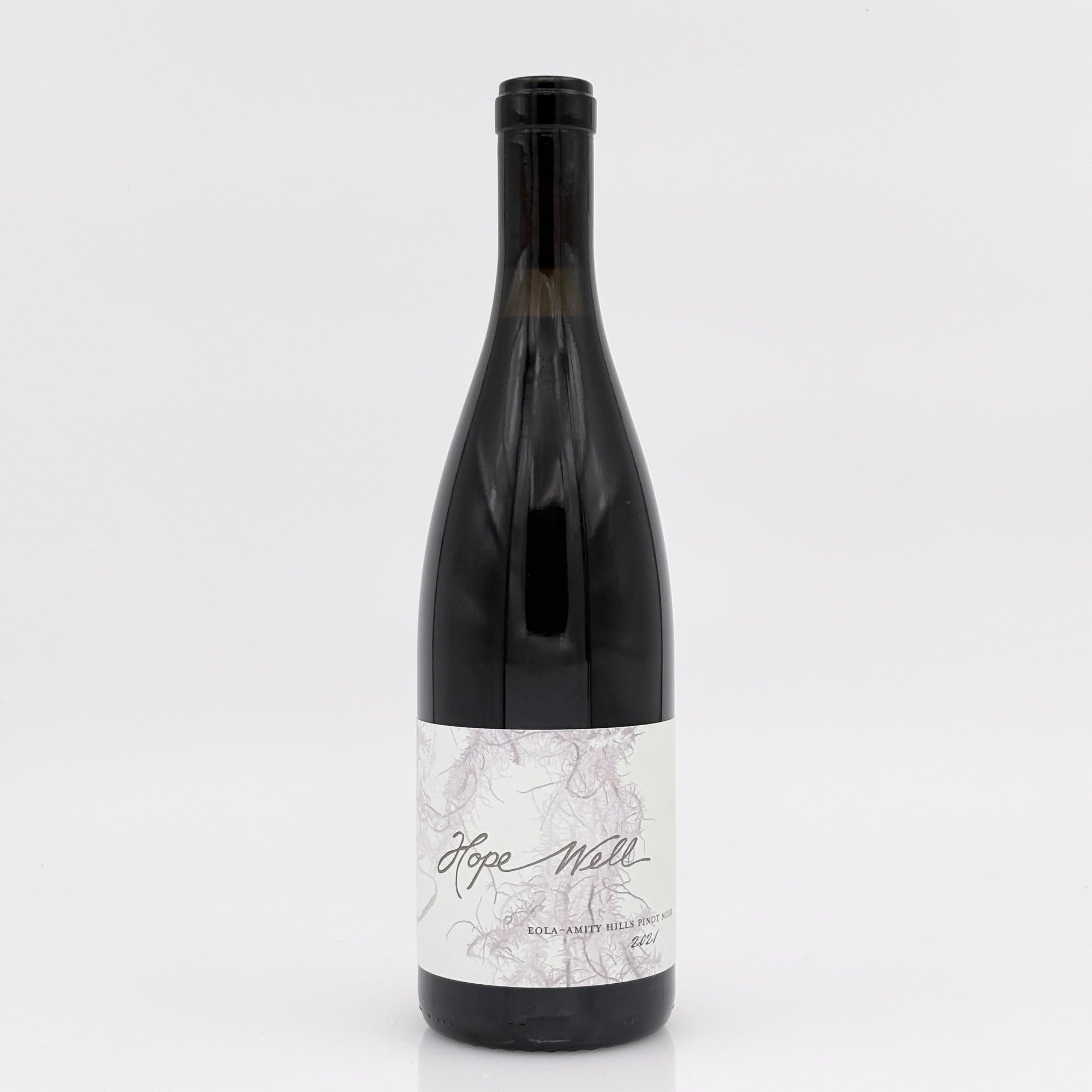 Wine bottle with a marble-patterned label on a white background