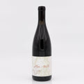 Wine bottle with a white label on a light gray background