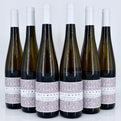 Six bottles of Kilburg wine with decorative labels on a white background