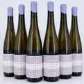Six bottles of Kilburg Riesling Trocken wine with purple bottle caps on a white background.
