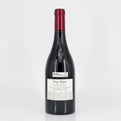 Red wine bottle with a visible label on a white background
