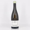 Wine bottle with a white label on a light gray background