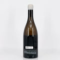 Wine bottle with a white label on a light gray background