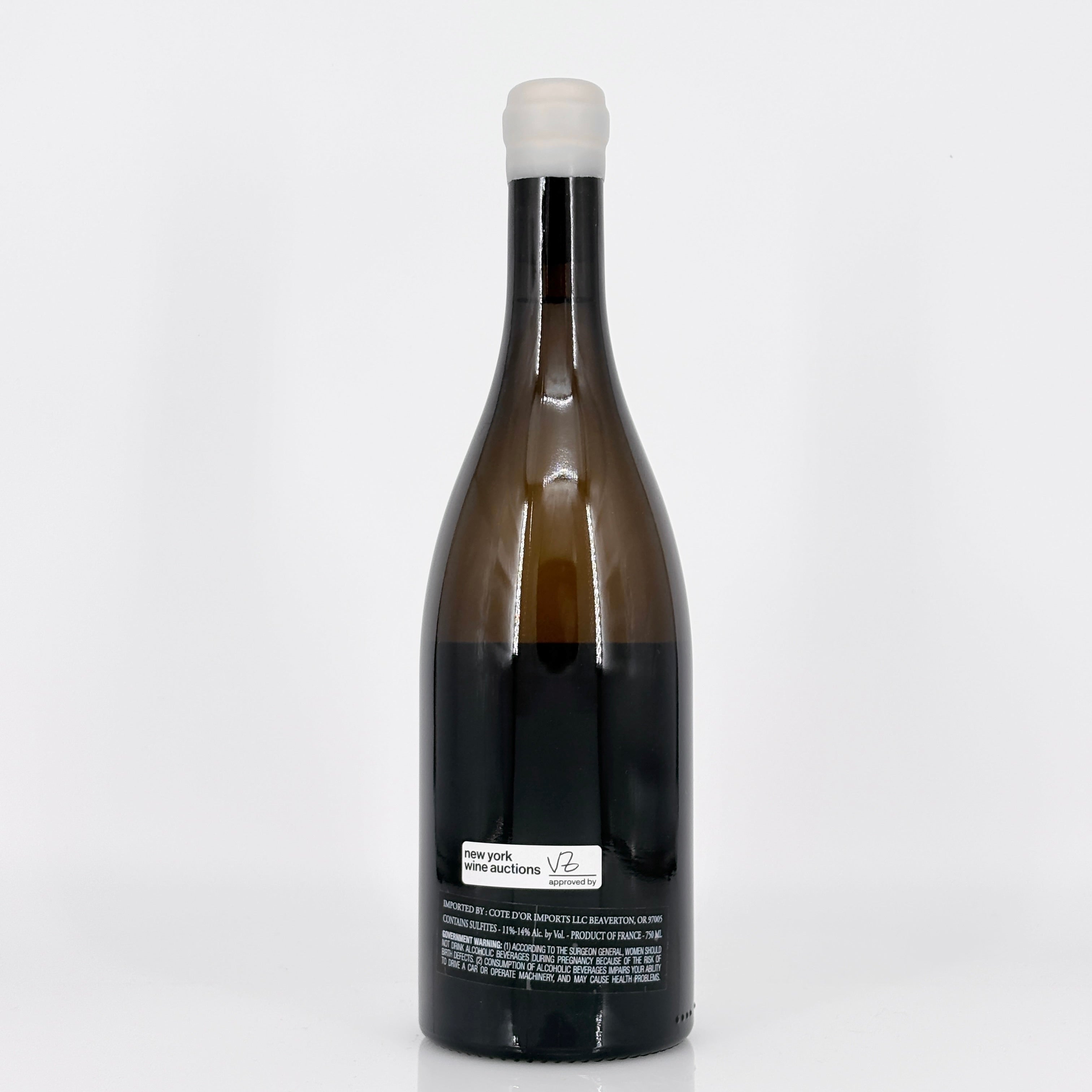 Wine bottle with a white label on a light gray background