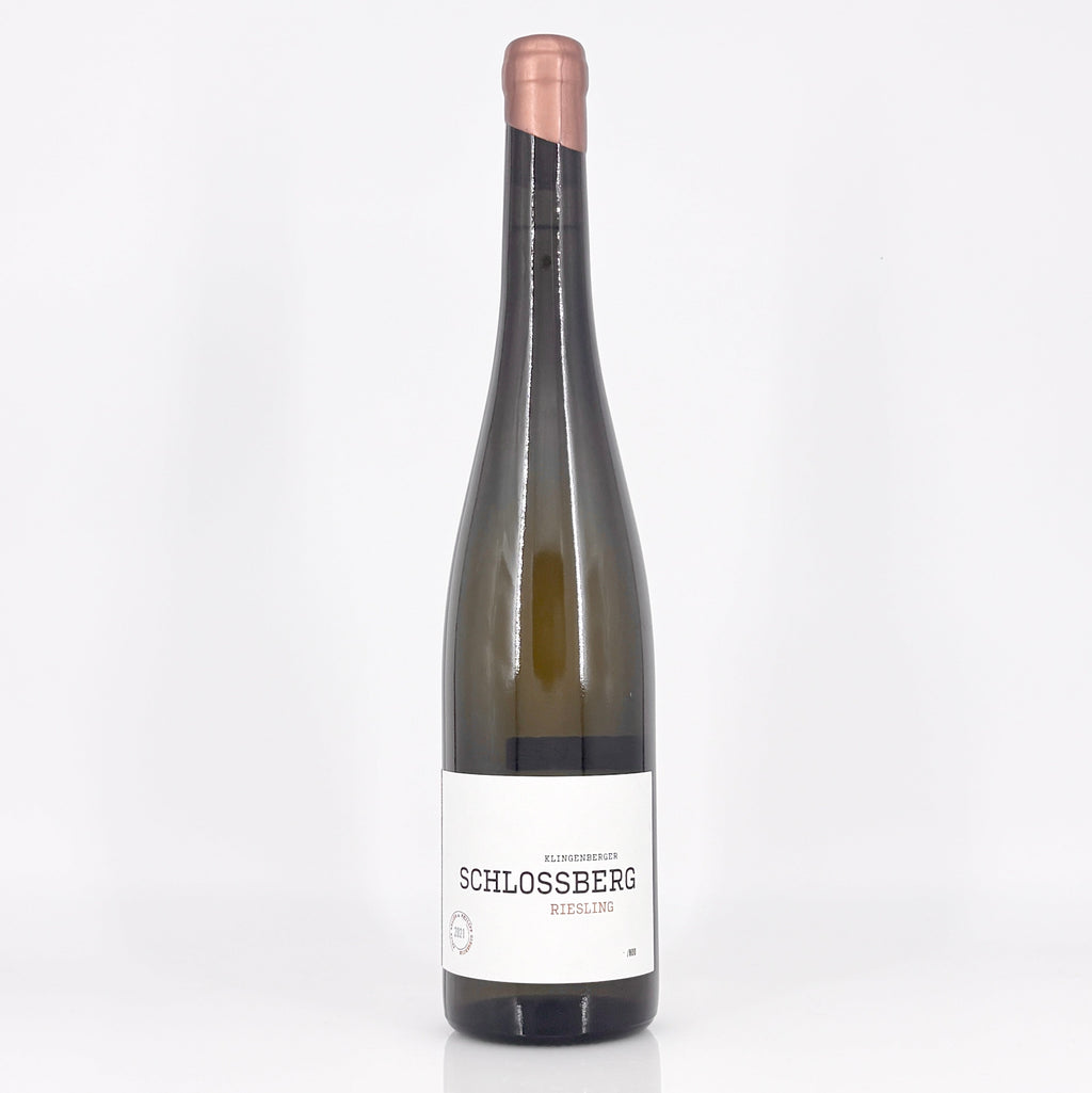 Wine bottle with 'Schlossberg' label on a white background