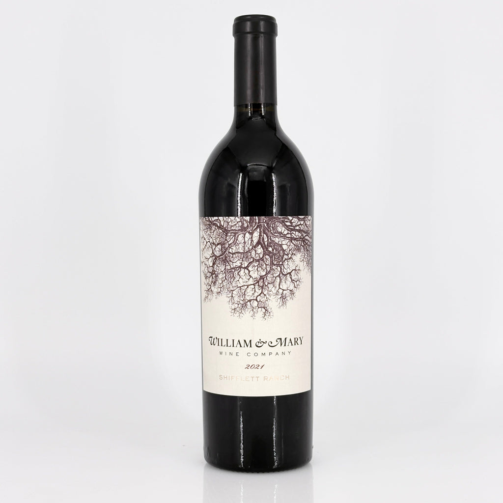 Wine bottle with a label featuring an tree design on a white background