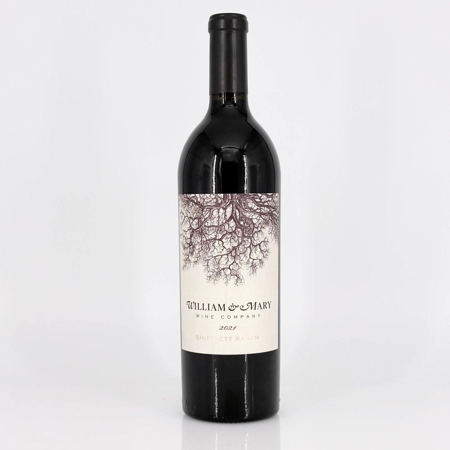Wine bottle with a label featuring an tree design on a white background