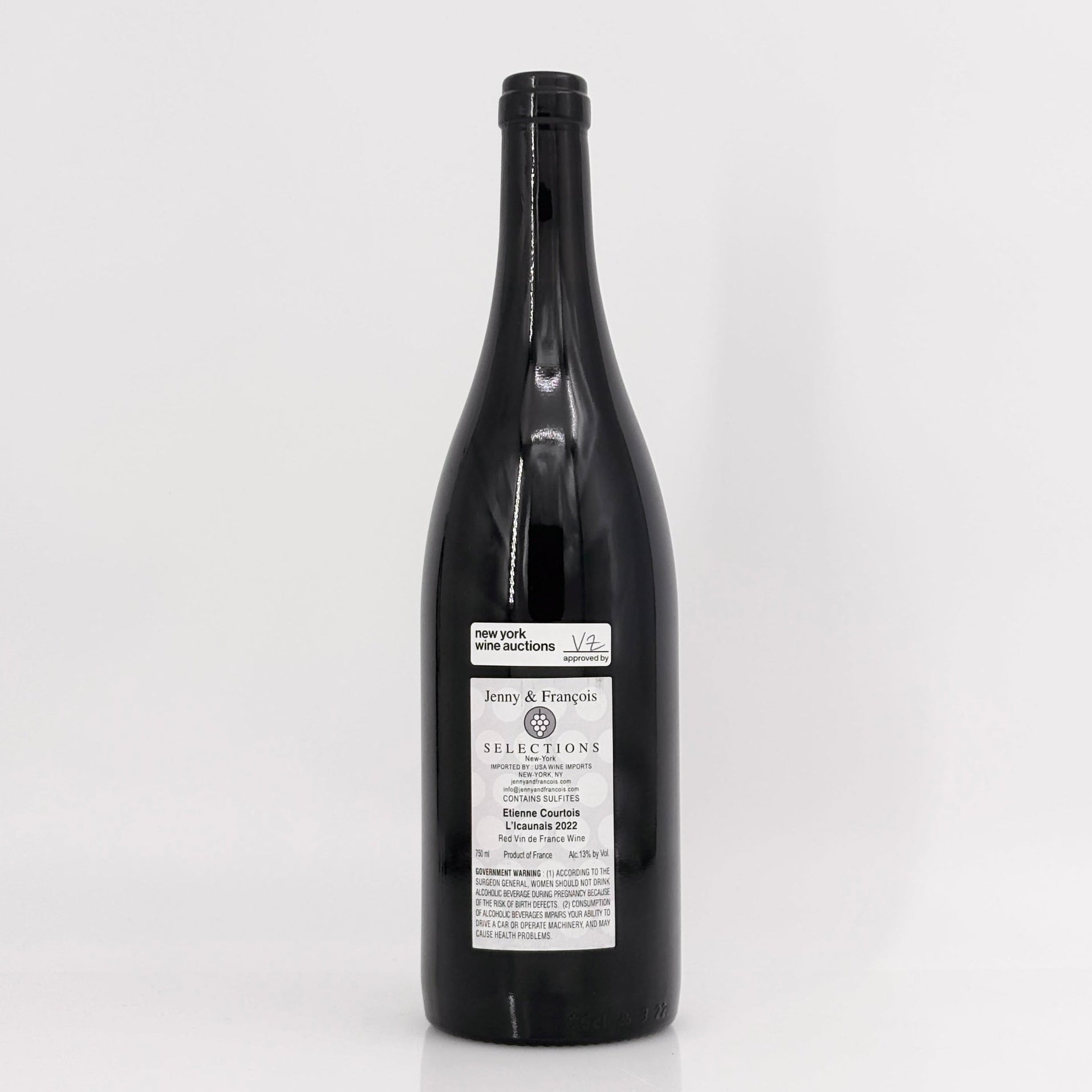 Black wine bottle with a label on a white background