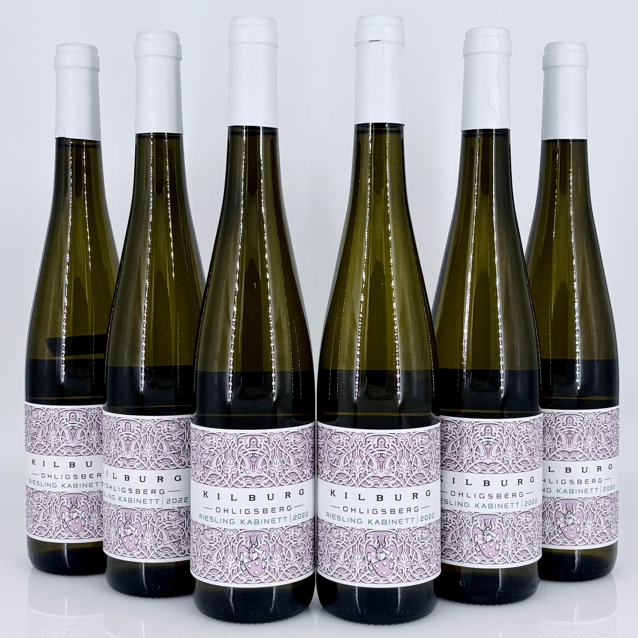 Six bottles of Kilburg wine with white labels on a light gray background