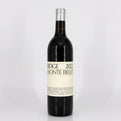 Wine bottle with a white label on a light gray background