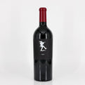 Red wine bottle with a black label on a white background