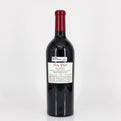 Red wine bottle with a visible label on a white background
