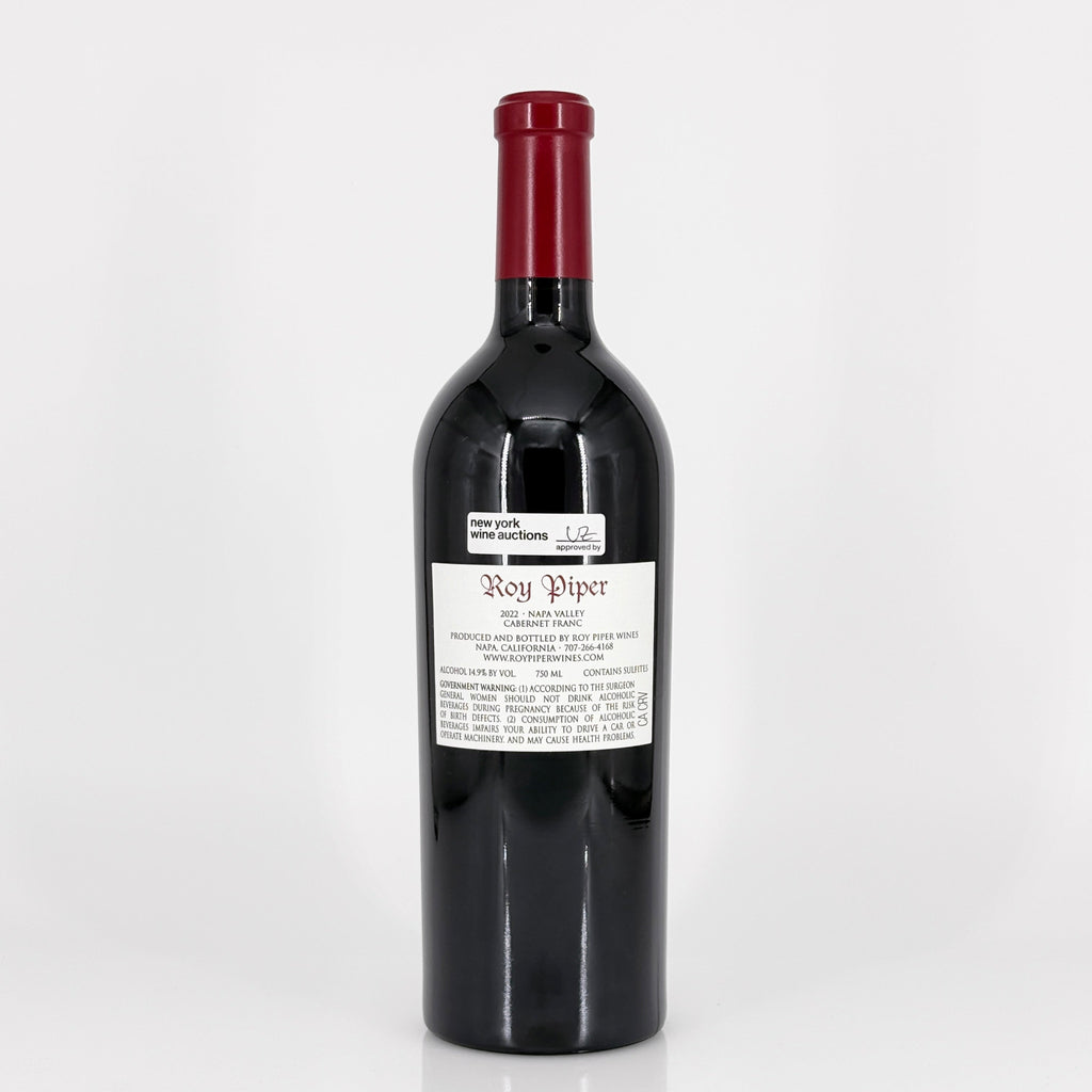 Red wine bottle with a visible label on a white background