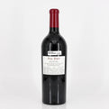 Red wine bottle with a visible label on a white background