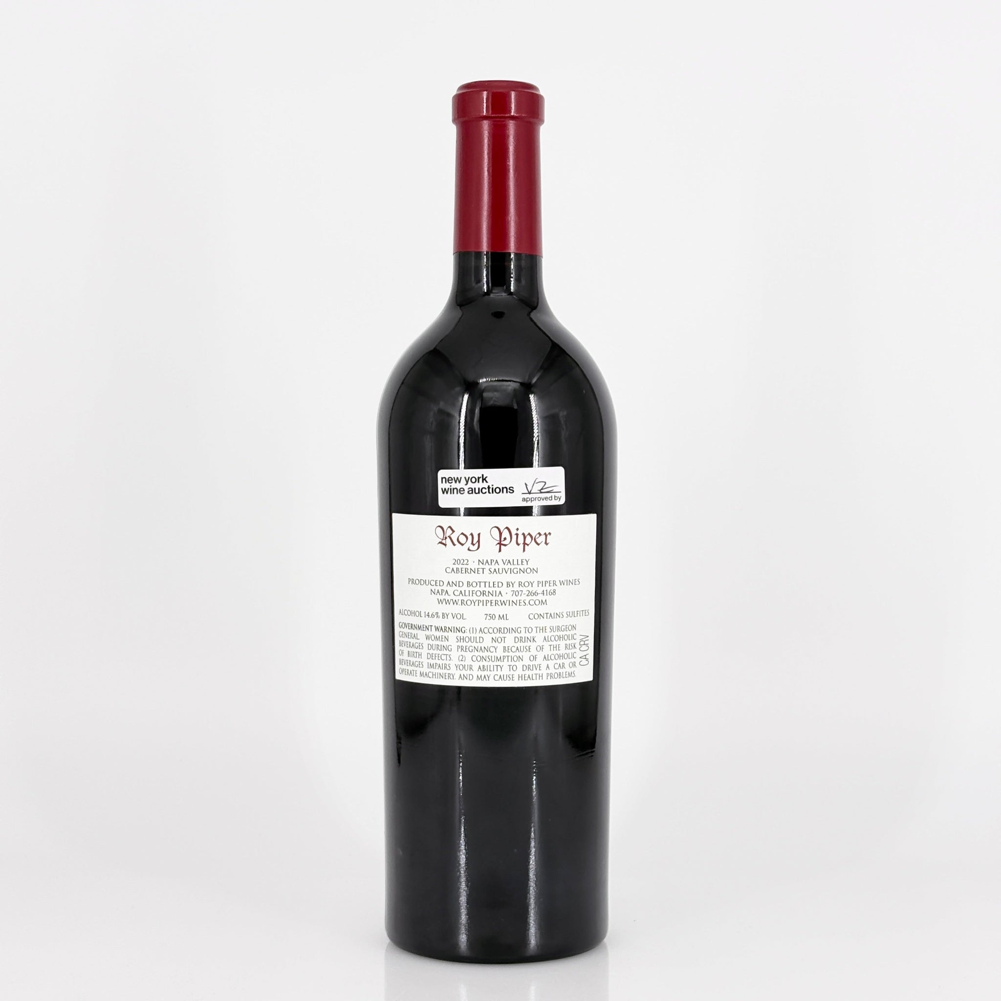 Red wine bottle with a visible label on a white background