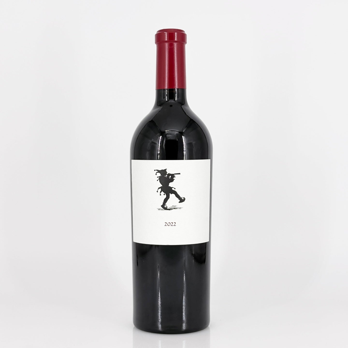 Red wine bottle with a label featuring a silhouette on a white background
