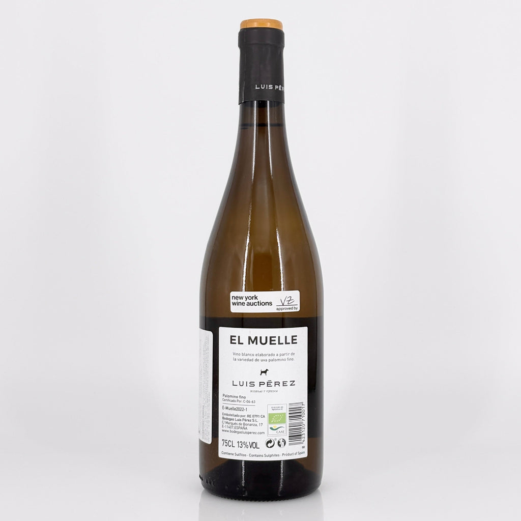 Wine bottle labeled 'El Muelle' by Luis Perez on a white background