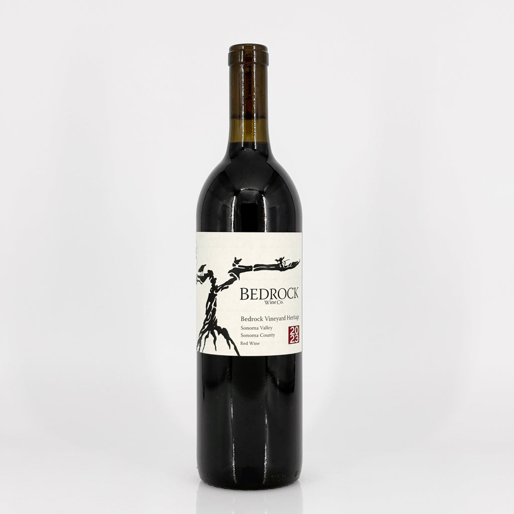 Red wine bottle with 'Bedrock' label on a white background