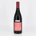 Wine bottle with a pink label on a white background