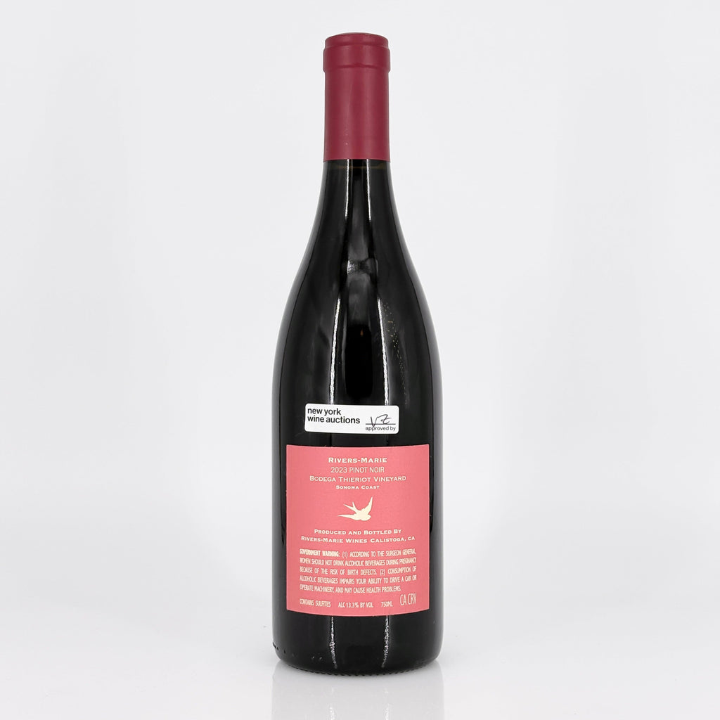 Wine bottle with a pink label on a white background