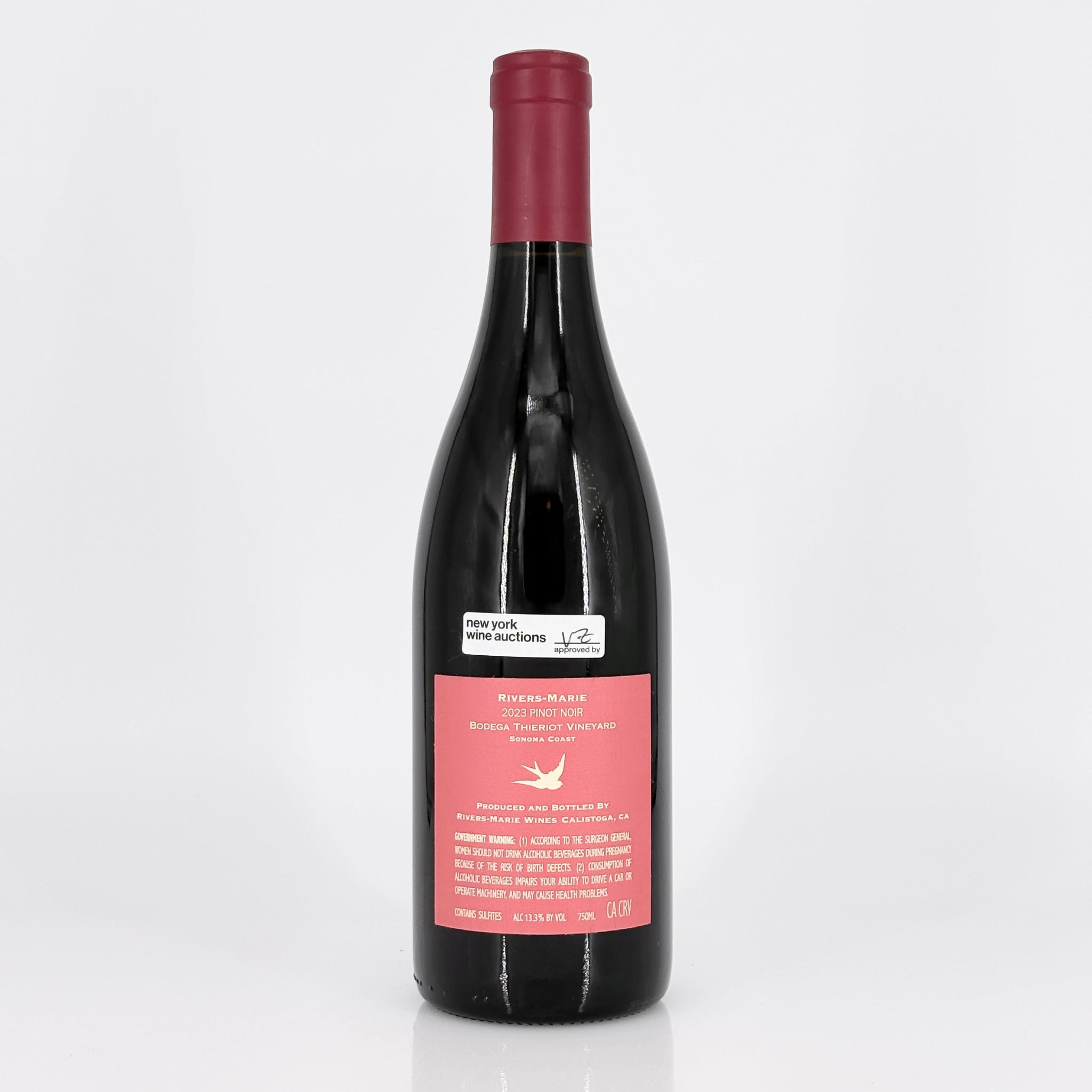 Wine bottle with a pink label on a white background