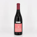 Wine bottle with a red label on a white background