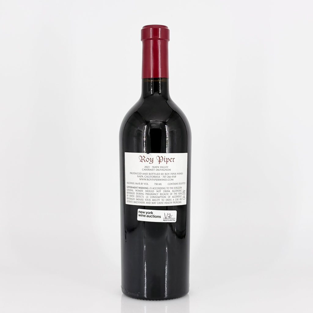 Red wine bottle with a visible label on a white background