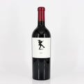 Red wine bottle with a white label featuring a black silhouette on a white background