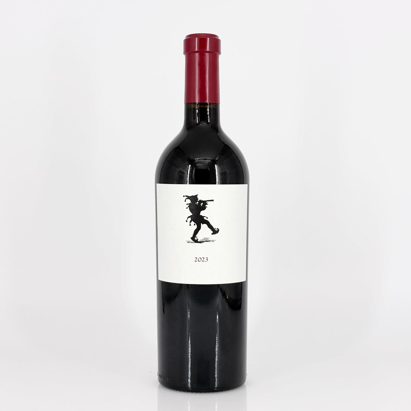 Red wine bottle with a white label featuring a black silhouette on a white background