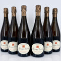 Six bottles of Georges Laval champagne on a white background